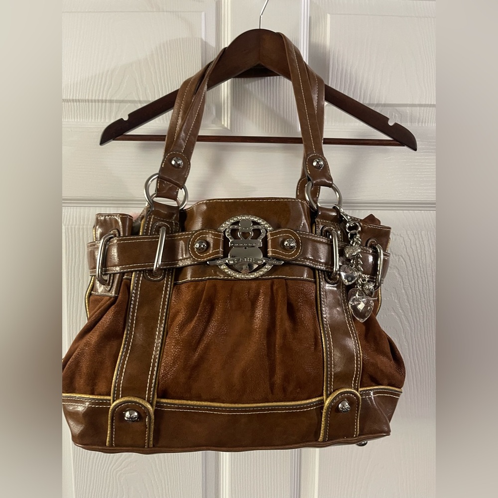 KATHY VAN ZEELAND BEAUTIFUL SUPER SPACIOUS BAG WITH CHARM.